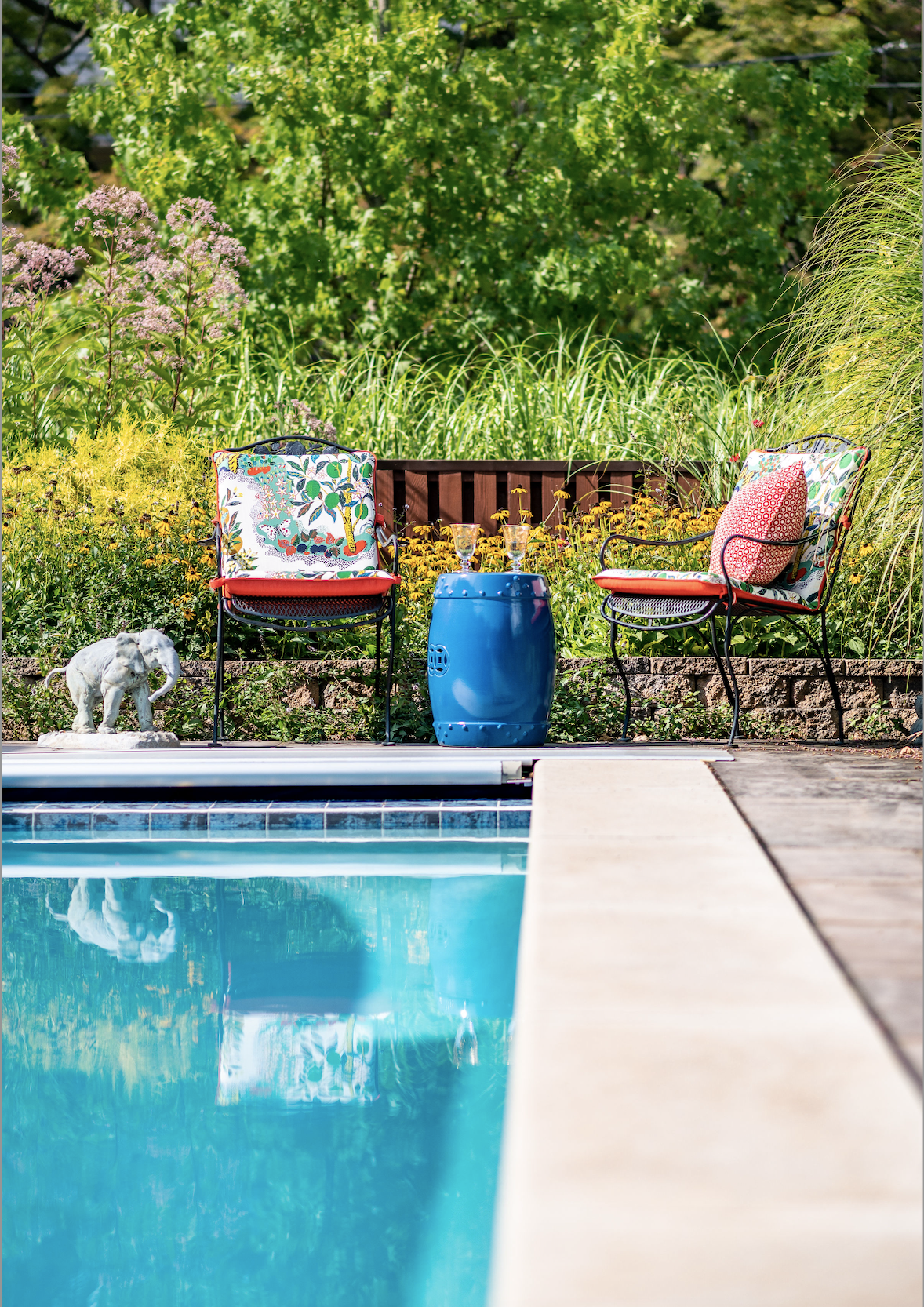 Two chairs by a pool